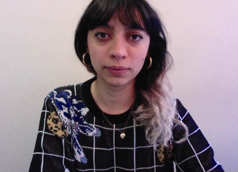 A Italian-Colombian woman with shoulder-length dark hair.
