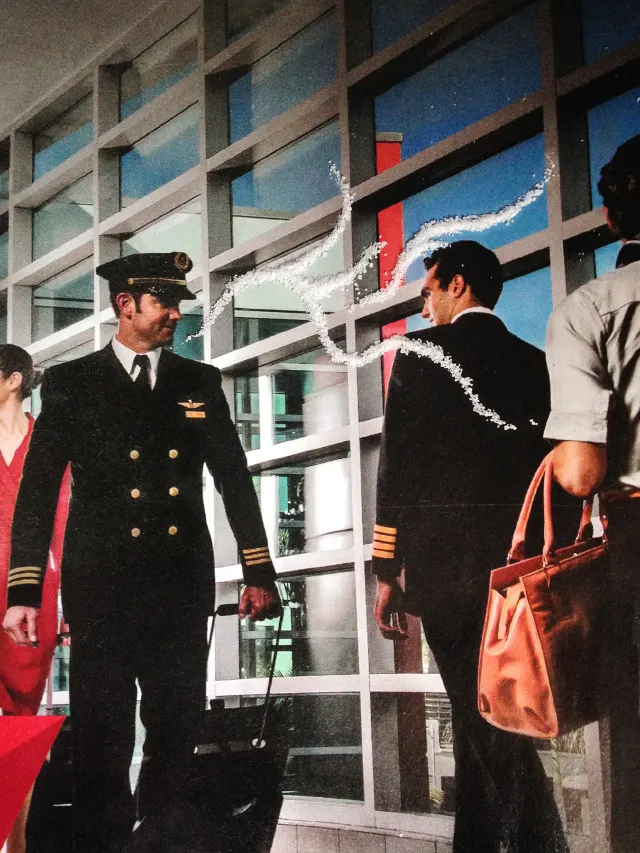 An advertising image of two pilots walking past one another and exchanging glances is enhanced by swirls of sugar placed on the page, suggesting a special chemistry between the two men.